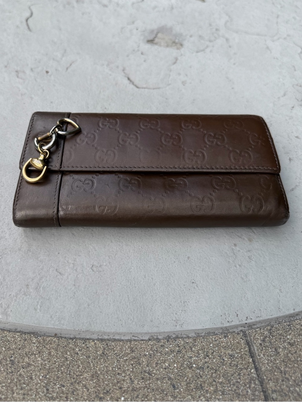 Gucci GG Embossed Leather Continental Wallet. With Charms.